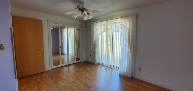 5729 Puncher Point Rd, Tower, MN 55790 - unfurnished room with wood finished floors and ceiling fan