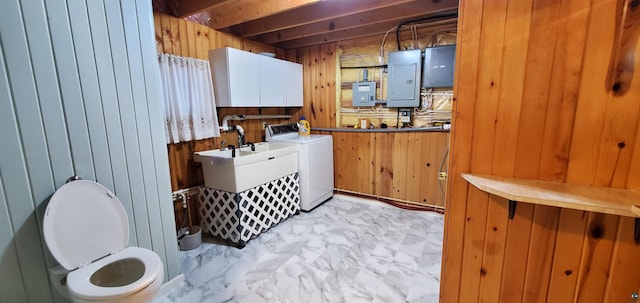 5729 Puncher Point Rd, Tower, MN 55790 - laundry area featuring washer / clothes dryer, wooden walls, electric panel, light marble finish flooring, and cabinet space