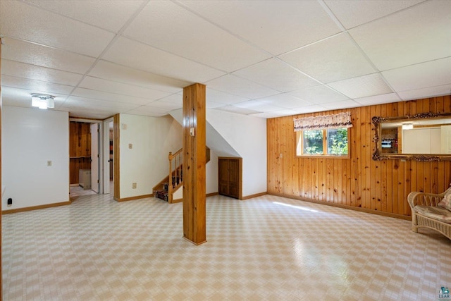 5729 Puncher Point Rd, Tower, MN 55790 - basement featuring a paneled ceiling, stairs, and wooden walls