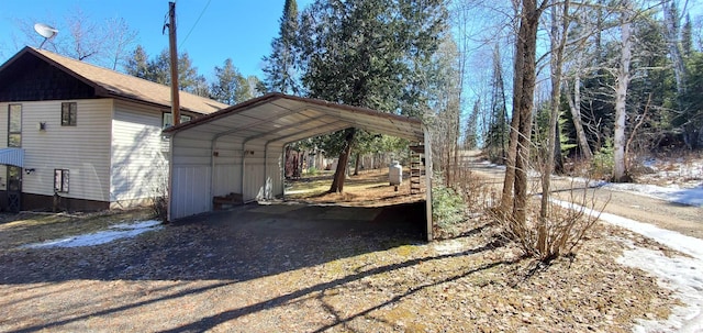 5729 Puncher Point Rd, Tower, MN 55790 - view of parking featuring a carport and dirt driveway