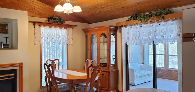 5729 Puncher Point Rd, Tower, MN 55790 - dining area featuring a chandelier, lofted ceiling, and wood ceiling