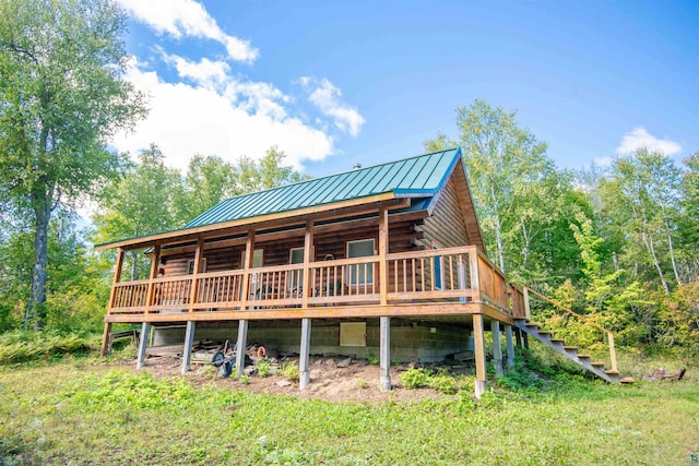 1808 Tom Lake Rd, Hovland, MN 55606 - rear view of property with a standing seam roof, log exterior, metal roof, a wooden deck, and stairs