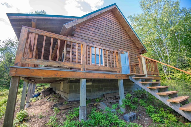 1808 Tom Lake Rd, Hovland, MN 55606 - back of house with stairway and a deck