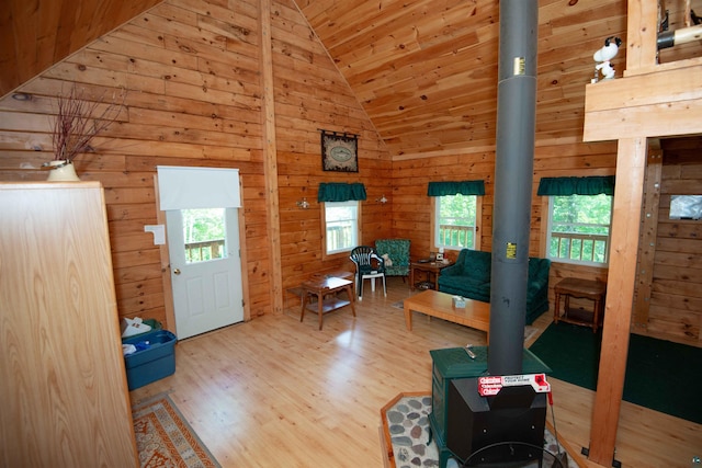 1808 Tom Lake Rd, Hovland, MN 55606 - foyer with wood finished floors, a wood stove, wooden walls, high vaulted ceiling, and wood ceiling