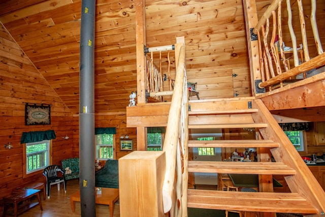 1808 Tom Lake Rd, Hovland, MN 55606 - stairs with wooden walls, wood ceiling, wood finished floors, and high vaulted ceiling
