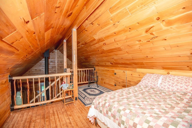 1808 Tom Lake Rd, Hovland, MN 55606 - bedroom with wooden walls, wooden ceiling, vaulted ceiling, and wood-type flooring