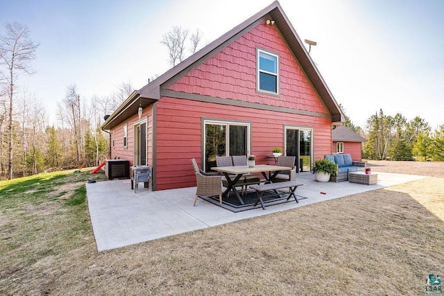 7070 Rice Lake Rd, Duluth, MN 55803 - rear view of house with a patio area, an outdoor living space, a yard, and central AC unit
