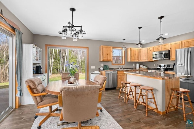 7070 Rice Lake Rd, Duluth, MN 55803 - dining room featuring a chandelier, dark wood finished floors, and recessed lighting