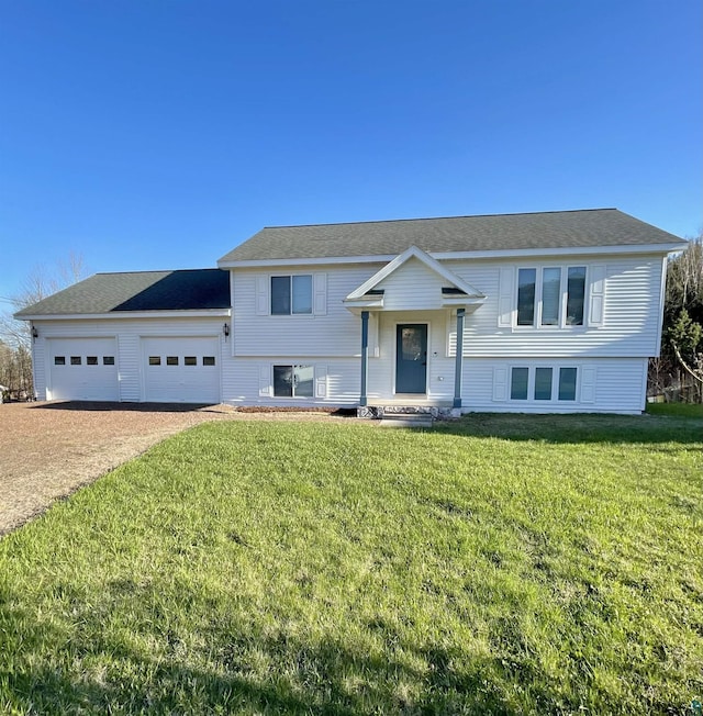 500 W 5th St, Grand Marais, MN 55604 - view of front facade with an attached garage, driveway, and a front lawn