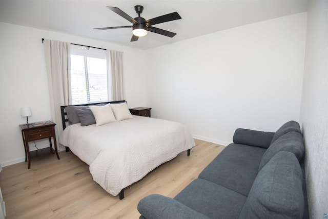 500 W 5th St, Grand Marais, MN 55604 - bedroom with light wood finished floors, baseboards, and ceiling fan
