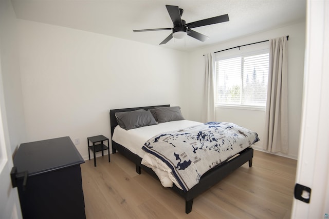 500 W 5th St, Grand Marais, MN 55604 - bedroom with light wood-type flooring and ceiling fan