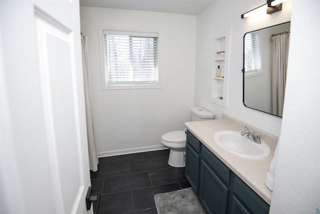 500 W 5th St, Grand Marais, MN 55604 - full bath featuring tile patterned floors, toilet, vanity, baseboards, and a shower with shower curtain