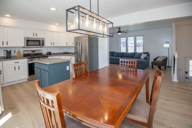 500 W 5th St, Grand Marais, MN 55604 - dining room with light wood finished floors, ceiling fan, and recessed lighting