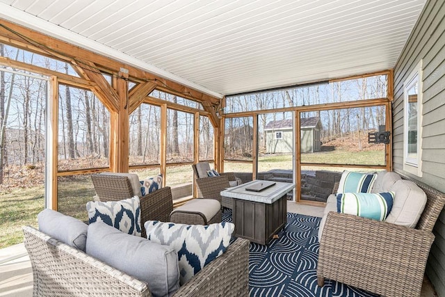 sunroom featuring outdoor lounge area