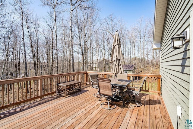wooden deck with outdoor dining space