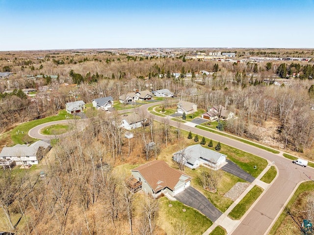 aerial view of property and surrounding area featuring nearby suburban area