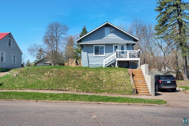 121 11th St, Cloquet, MN 55720 - bungalow-style house featuring stairway and a porch
