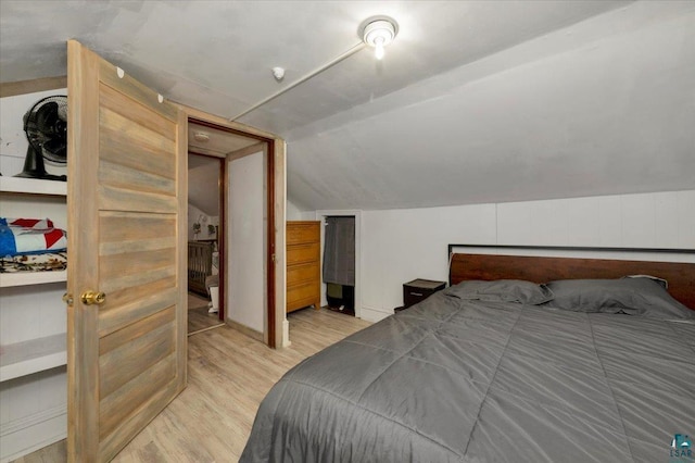 121 11th St, Cloquet, MN 55720 - bedroom with light wood-style flooring and lofted ceiling