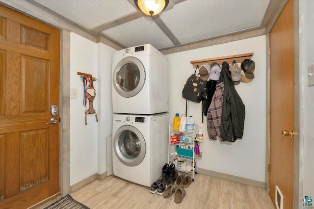 121 11th St, Cloquet, MN 55720 - washroom featuring stacked washer and clothes dryer, light wood finished floors, and baseboards