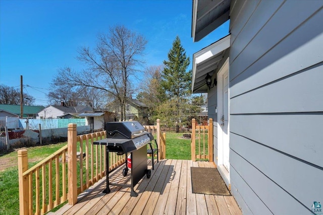 121 11th St, Cloquet, MN 55720 - wooden terrace featuring a grill