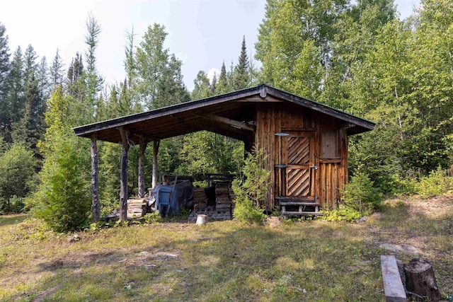 489 Brule Valley Trl, Hovland, MN 55606 - view of outbuilding with a wooded view