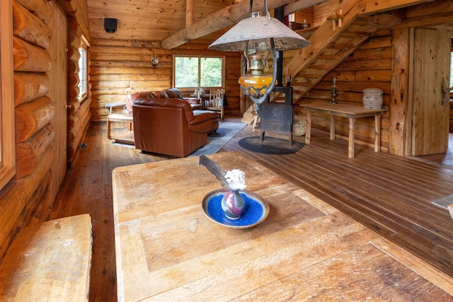 489 Brule Valley Trl, Hovland, MN 55606 - living area featuring wood-type flooring, rustic walls, a wood stove, wood ceiling, and lofted ceiling