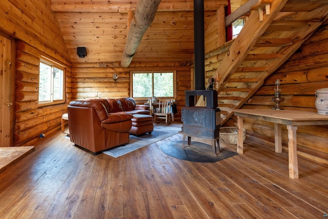 489 Brule Valley Trl, Hovland, MN 55606 - living area featuring a wood stove, wood-type flooring, wooden ceiling, and log walls