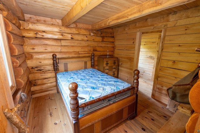 489 Brule Valley Trl, Hovland, MN 55606 - bedroom featuring wooden ceiling, light wood-style flooring, beam ceiling, and log walls