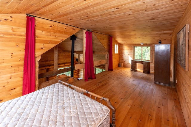 489 Brule Valley Trl, Hovland, MN 55606 - bedroom with wooden walls, hardwood / wood-style floors, wood ceiling, and vaulted ceiling
