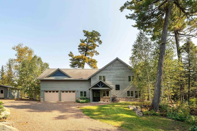 879 Clearwater Rd, Grand Marais, MN 55604 - view of front facade featuring driveway and a front yard