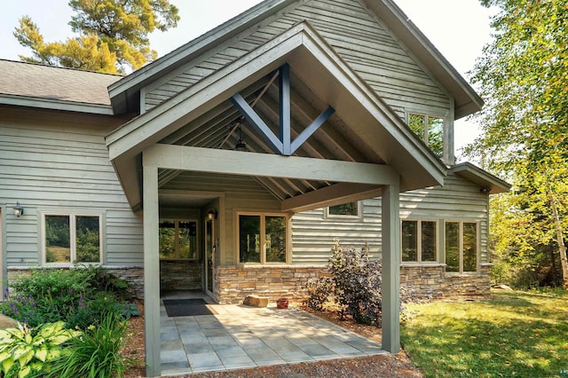 879 Clearwater Rd, Grand Marais, MN 55604 - entrance to property with a patio and a yard