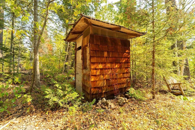 879 Clearwater Rd, Grand Marais, MN 55604 - view of shed with a wooded view