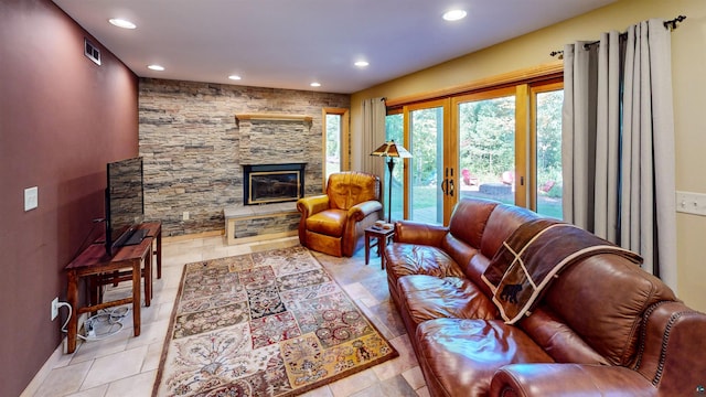 879 Clearwater Rd, Grand Marais, MN 55604 - living room with recessed lighting, a stone fireplace, and baseboards