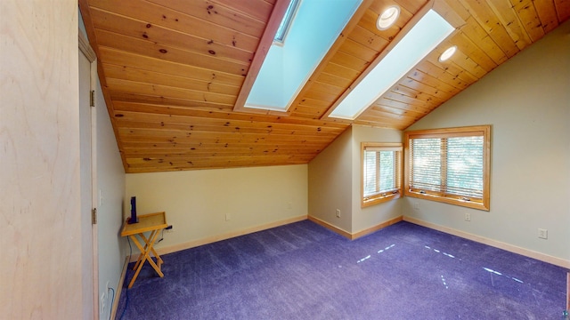 879 Clearwater Rd, Grand Marais, MN 55604 - bonus room with a skylight, lofted ceiling, wood ceiling, baseboards, and dark carpet