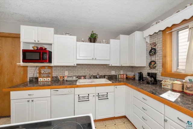 726 Laurel St, Cloquet, MN 55720 - kitchen featuring a sink, white dishwasher, a textured ceiling, white cabinetry, and decorative backsplash