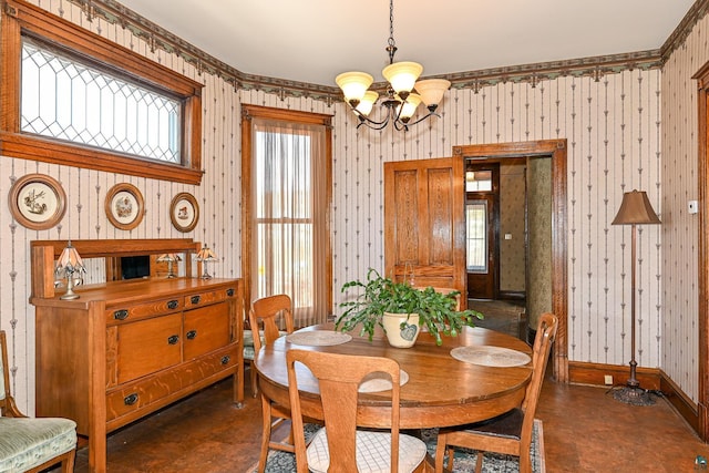 dining space with a chandelier, wallpapered walls, plenty of natural light, and baseboards