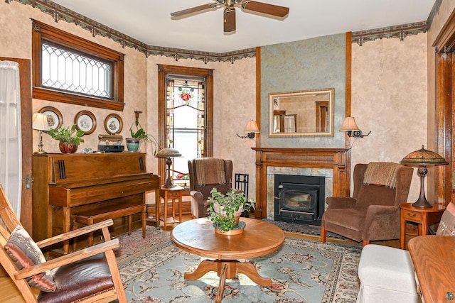 living area featuring a ceiling fan and wood finished floors