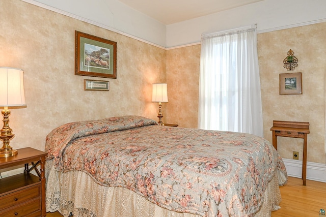 bedroom featuring wood finished floors