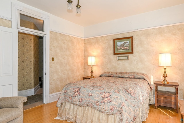 bedroom with light wood-type flooring