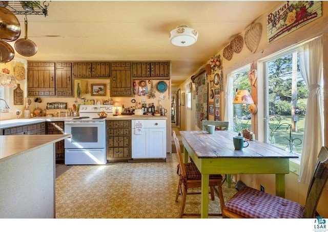 7262 Palo Tia Rd, Embarrass, MN 55732 - kitchen featuring white electric range, a sink, and light countertops