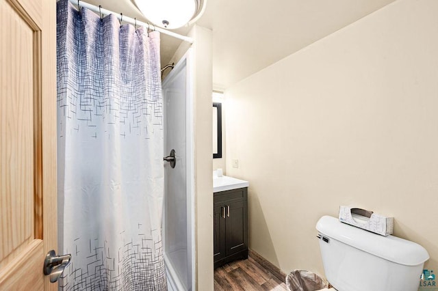 full bath with wood finished floors, vanity, a shower with curtain, and toilet