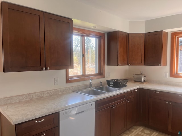 5346 Lester River Rd, Duluth, MN 55804 - kitchen with dishwasher, a sink, and light countertops