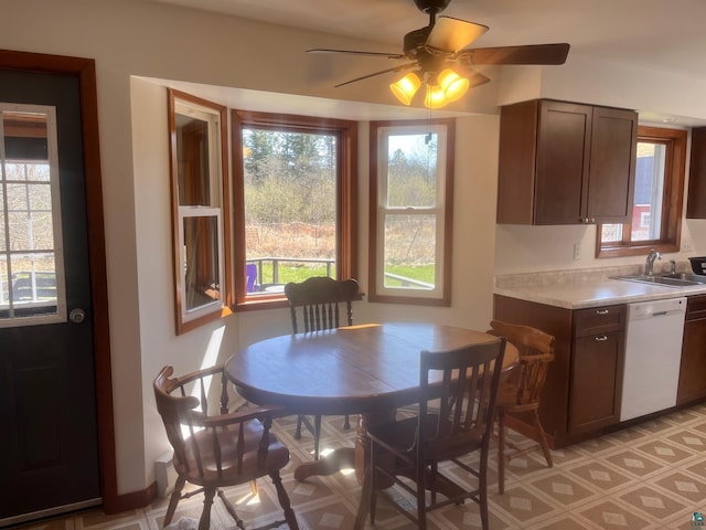 5346 Lester River Rd, Duluth, MN 55804 - dining room with ceiling fan, light floors, and baseboards
