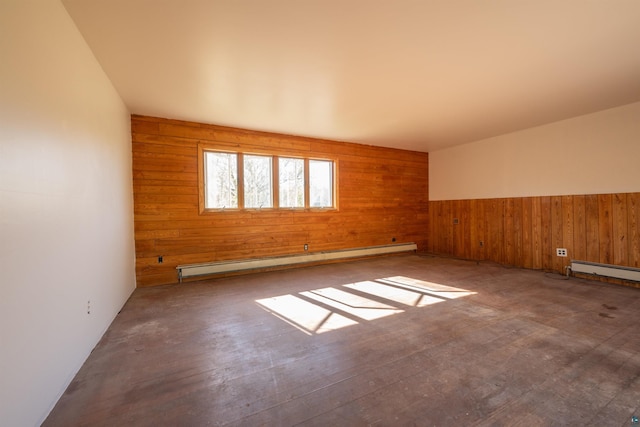 77 Solway Rd, Esko, MN 55733 - unfurnished room featuring a baseboard heating unit and wood walls