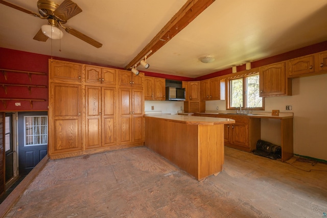 77 Solway Rd, Esko, MN 55733 - kitchen with a peninsula, brown cabinets, a ceiling fan, light countertops, and a sink