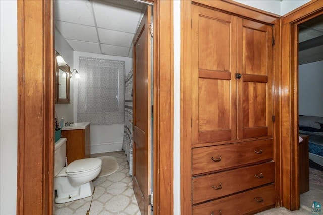 304 Carlton Ave, Cloquet, MN 55720 - full bath featuring toilet, a drop ceiling, and vanity