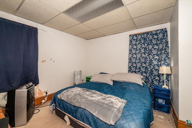 304 Carlton Ave, Cloquet, MN 55720 - carpeted bedroom featuring a paneled ceiling and baseboards