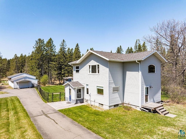 5465 Arnold Rd, Duluth, MN 55803 - traditional home featuring a detached garage, a shingled roof, and an outdoor structure