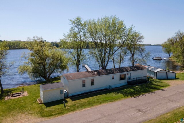 10412 Lakeside Dr, Finlayson, MN 55735 - view of front of property with a water view, a front lawn, an outdoor structure, and a detached garage