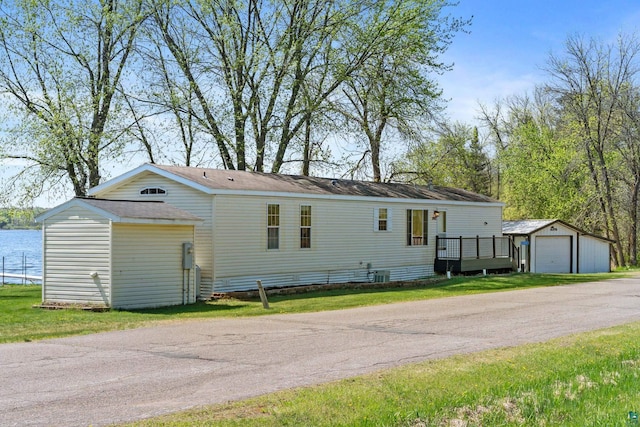10412 Lakeside Dr, Finlayson, MN 55735 - manufactured / mobile home with an outbuilding, a garage, and roof with shingles